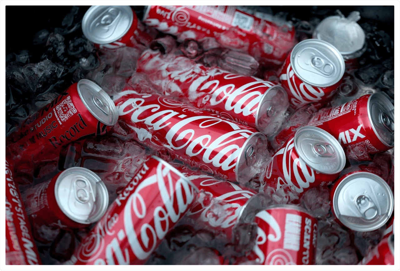 Classic Coca-Cola cans on ice